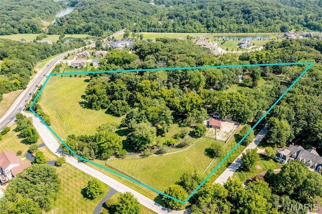 1577 Kehrs Mill Rd, Chesterfield, MO 63005 - aerial view of property and surrounding area featuring property parcel outlined, a large body of water, and a forest