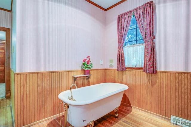 1577 Kehrs Mill Rd, Chesterfield, MO 63005 - full bath with a wainscoted wall, a soaking tub, ornamental molding, wood finished floors, and wood walls