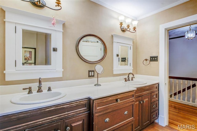 1577 Kehrs Mill Rd, Chesterfield, MO 63005 - bathroom featuring ornamental molding, a chandelier, double vanity, and wood finished floors