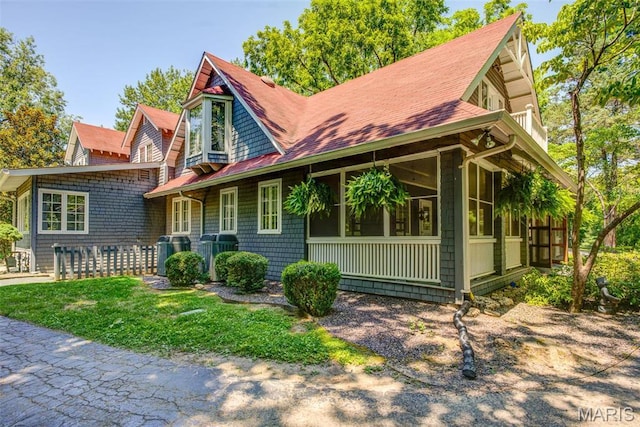 1577 Kehrs Mill Rd, Chesterfield, MO 63005 - view of front facade with a sunroom and roof with shingles