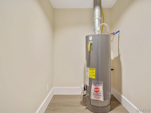 utility room featuring water heater