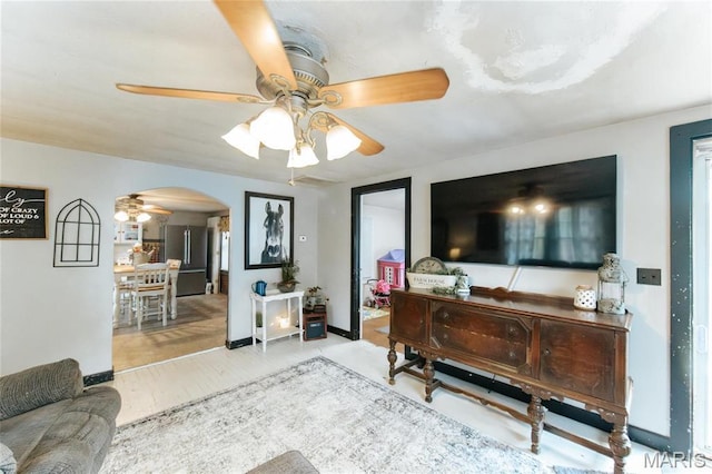 631 State Route T, Newburg, MO 65550 - living area with a ceiling fan, arched walkways, and wood finished floors