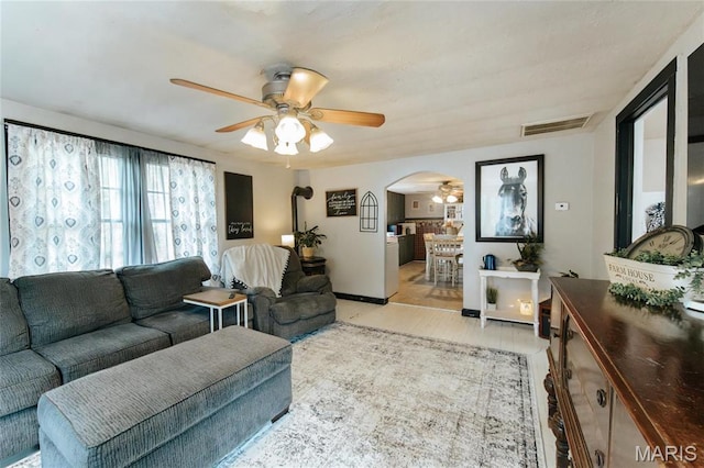 631 State Route T, Newburg, MO 65550 - living area featuring arched walkways, a ceiling fan, and light wood finished floors