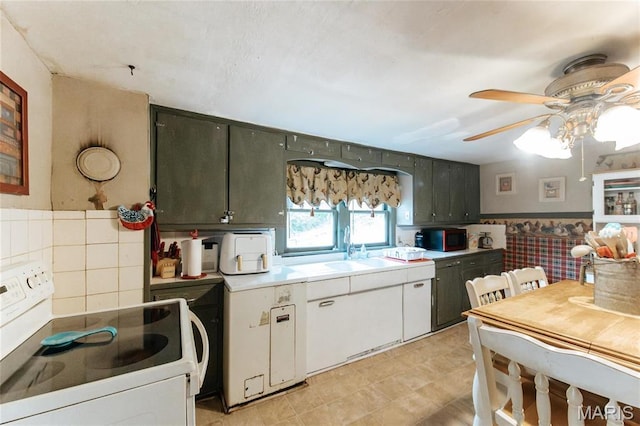 631 State Route T, Newburg, MO 65550 - kitchen featuring white electric range, a ceiling fan, a sink, black microwave, and light countertops
