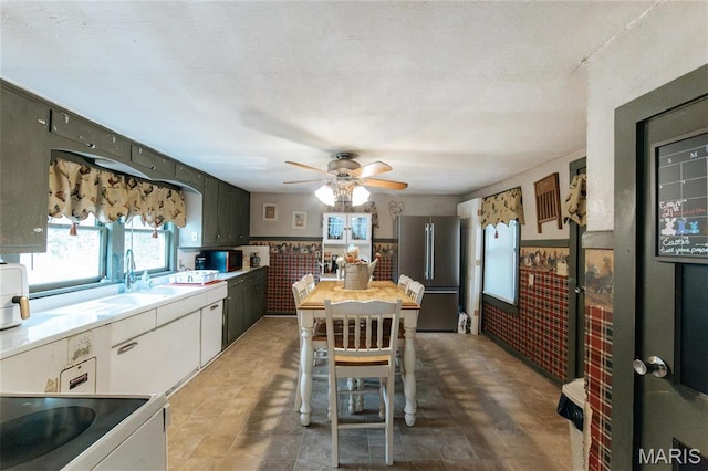 631 State Route T, Newburg, MO 65550 - kitchen featuring freestanding refrigerator, electric range oven, a ceiling fan, a sink, and light countertops