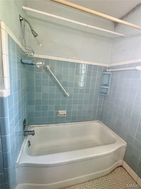 1709 Korando Ave, Saint Louis, MO 63114 - full bathroom with tile patterned flooring, tub / shower combination, and tile walls