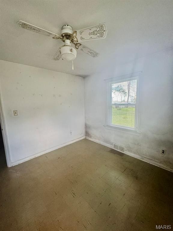 1709 Korando Ave, Saint Louis, MO 63114 - empty room featuring dark floors and ceiling fan
