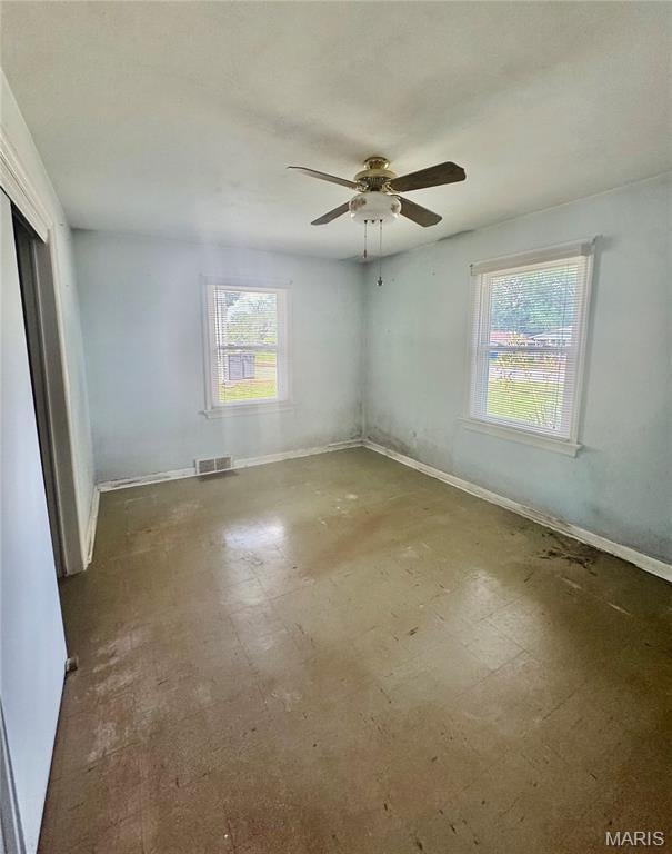 1709 Korando Ave, Saint Louis, MO 63114 - empty room featuring baseboards and a ceiling fan
