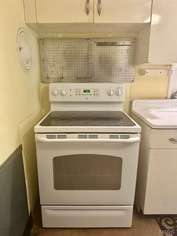 1709 Korando Ave, Saint Louis, MO 63114 - detailed view of white electric stove and light countertops