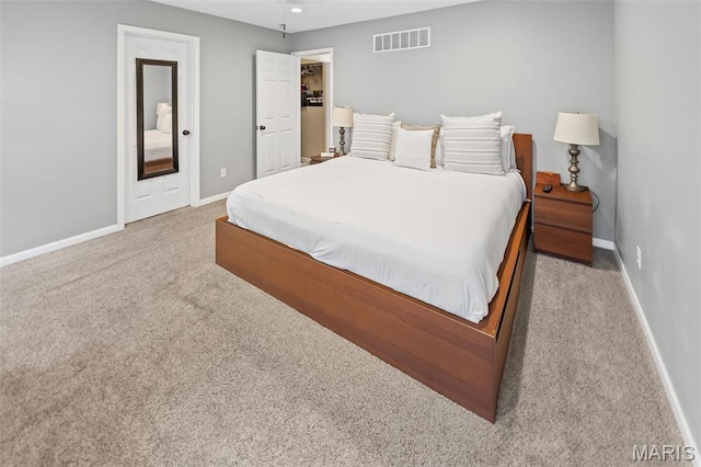 carpeted bedroom featuring baseboards