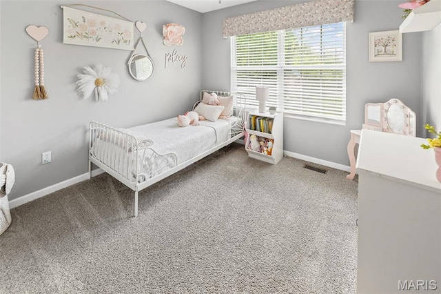 bedroom featuring baseboards and carpet floors