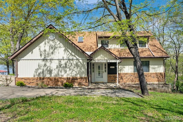 1211 Napoleon Dr, Bonne Terre, MO 63628 - view of front facade featuring brick siding and a front yard