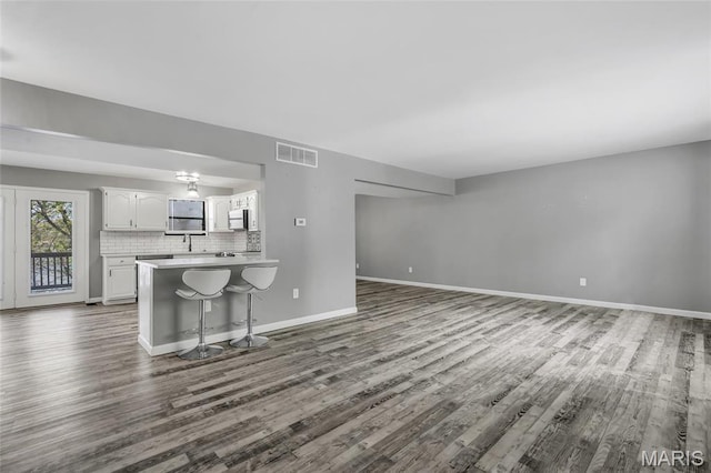 1211 Napoleon Dr, Bonne Terre, MO 63628 - living room with dark wood-style floors and baseboards