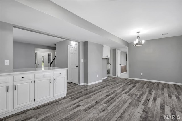 1211 Napoleon Dr, Bonne Terre, MO 63628 - unfurnished living room with wood finished floors, a chandelier, and baseboards