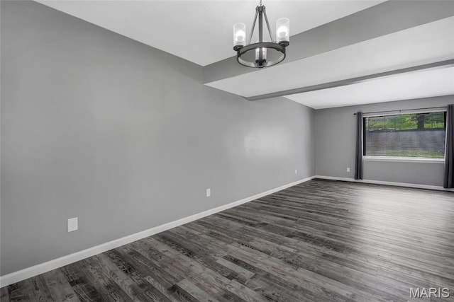 1211 Napoleon Dr, Bonne Terre, MO 63628 - empty room featuring a chandelier, dark wood-style floors, and baseboards