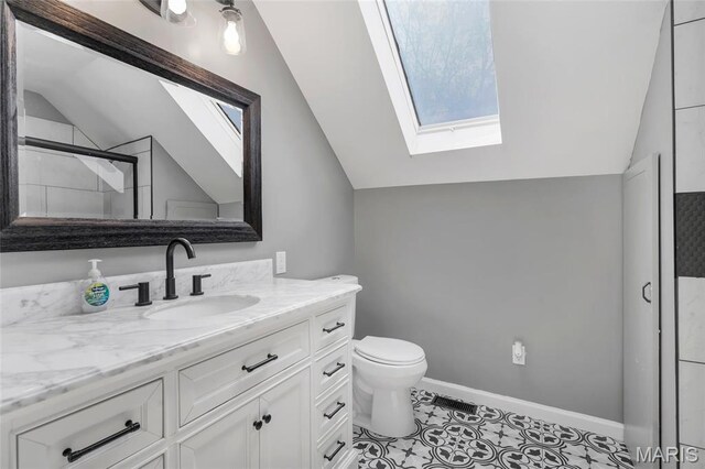 1211 Napoleon Dr, Bonne Terre, MO 63628 - full bathroom with lofted ceiling, a skylight, vanity, a shower, and toilet