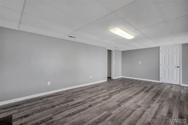 1211 Napoleon Dr, Bonne Terre, MO 63628 - finished below grade area with a paneled ceiling, dark wood-style flooring, and baseboards
