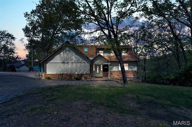 1211 Napoleon Dr, Bonne Terre, MO 63628 - view of front of property with a front yard and brick siding
