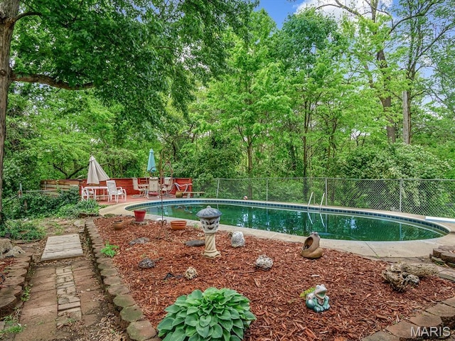 126 Sunset Ave, Collinsville, IL 62234 - view of swimming pool featuring a patio, fence, and a diving board