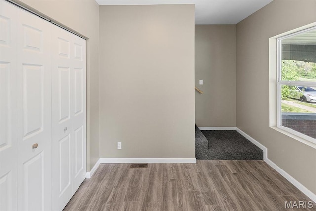 1129 E 7th St, Alton, IL 62002 - unfurnished room with wood finished floors and baseboards