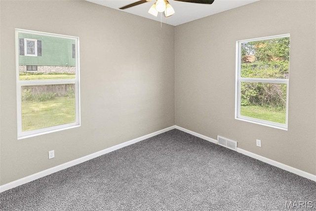 1129 E 7th St, Alton, IL 62002 - unfurnished room featuring a ceiling fan, carpet floors, and baseboards