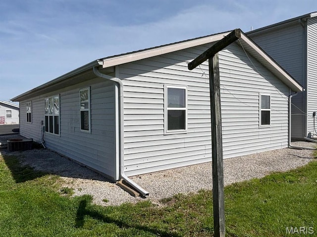 view of property exterior featuring a lawn