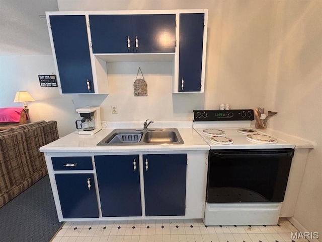 kitchen with blue cabinets, range with electric stovetop, a sink, and light countertops