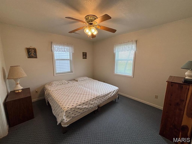 bedroom featuring carpet, baseboards, and a ceiling fan