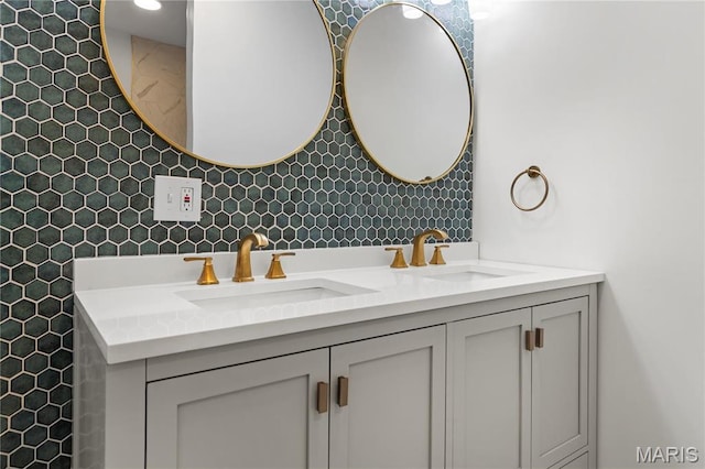full bathroom featuring double vanity and tasteful backsplash