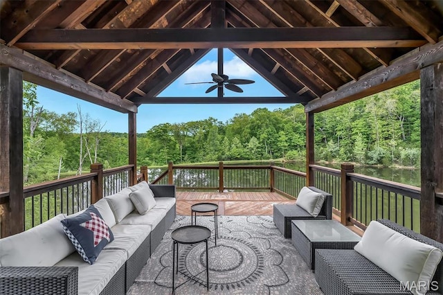 wooden deck featuring a ceiling fan, an outdoor hangout area, and a gazebo