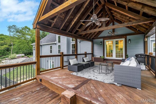 wooden deck with ceiling fan and an outdoor hangout area