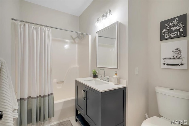 bathroom with toilet, shower / bath combo, and vanity