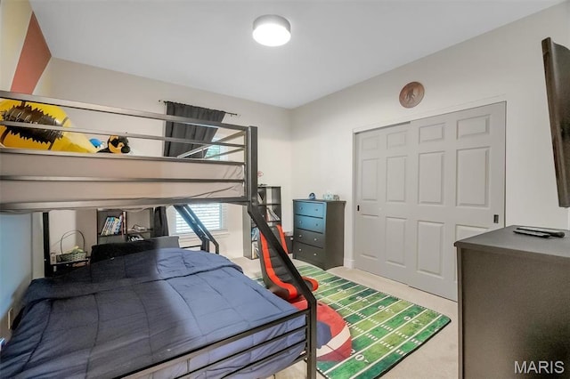 bedroom with carpet floors and a closet