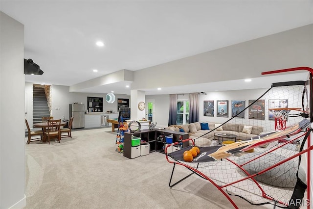 carpeted living room with stairway and recessed lighting