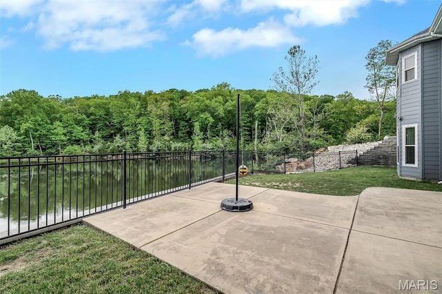view of patio with a wooded view