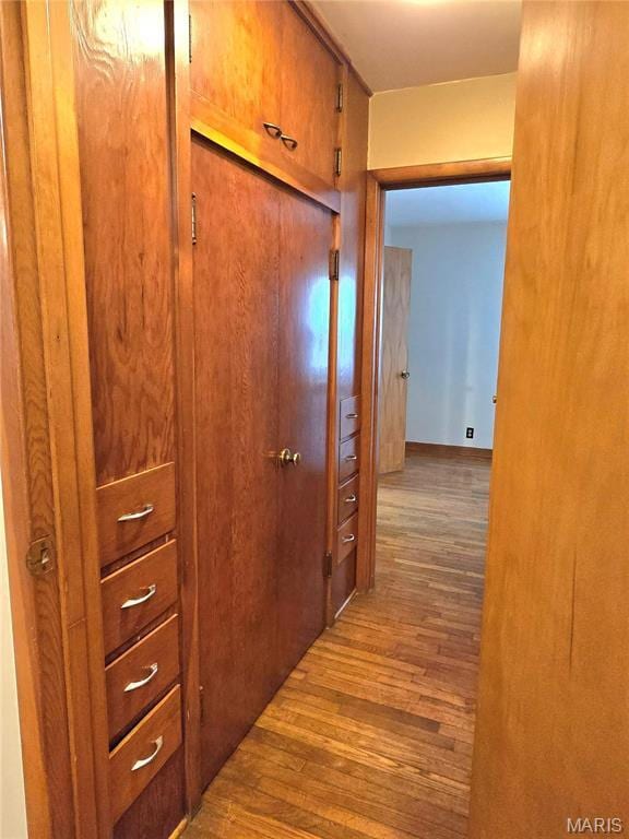 hallway with wood finished floors
