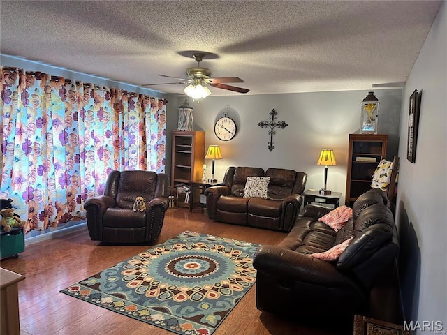 634 N 425th Rd, Bertrand, MO 63823 - living room with a ceiling fan, a textured ceiling, and wood finished floors