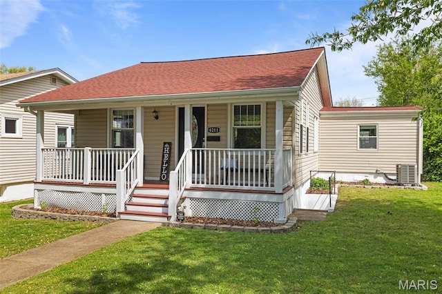 6211 Odell St, Saint Louis, MO 63139 - view of front of home featuring a porch, central air condition unit, and a front lawn