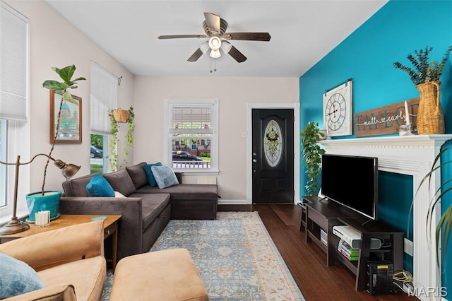 6211 Odell St, Saint Louis, MO 63139 - living area with a ceiling fan, wood finished floors, and baseboards