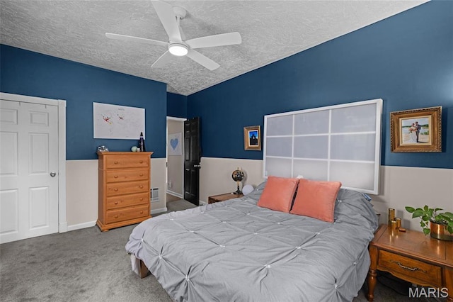 6211 Odell St, Saint Louis, MO 63139 - carpeted bedroom with a textured ceiling and a ceiling fan