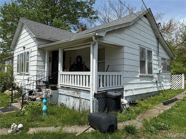 108 Hampton Ave, Park Hills, MO 63601 - view of side of home featuring a chimney, roof with shingles, and a porch