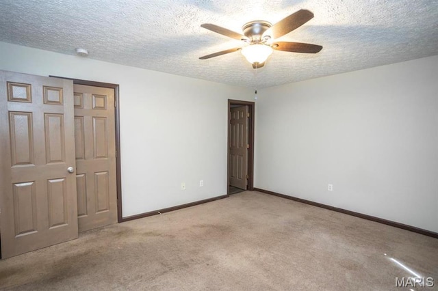 15625 Talon Ln, Saint Robert, MO 65584 - unfurnished bedroom featuring carpet floors, baseboards, a textured ceiling, and ceiling fan