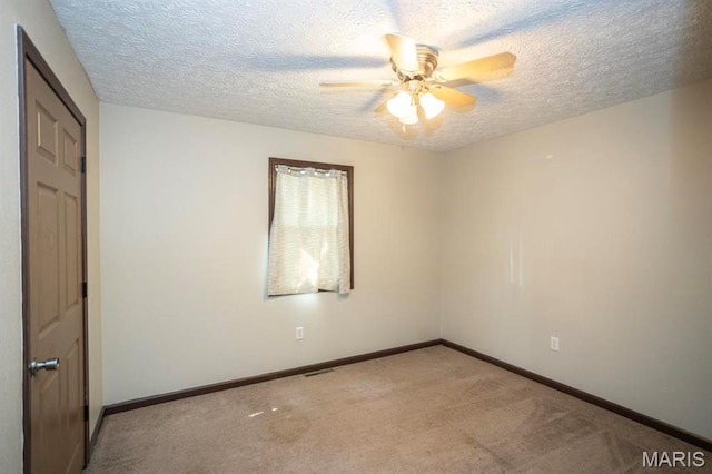 15625 Talon Ln, Saint Robert, MO 65584 - unfurnished room with a ceiling fan, light colored carpet, a textured ceiling, and baseboards