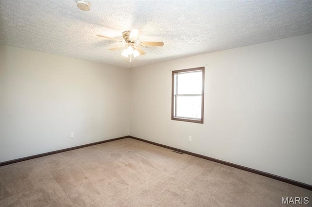 15625 Talon Ln, Saint Robert, MO 65584 - empty room with ceiling fan, light colored carpet, a textured ceiling, baseboards, and a smoke detector