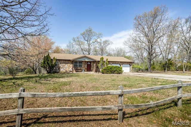 15625 Talon Ln, Saint Robert, MO 65584 - single story home featuring concrete driveway, an attached garage, and stone siding