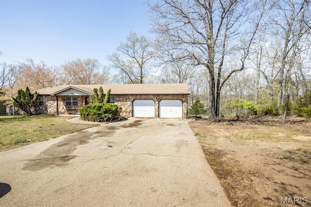 15625 Talon Ln, Saint Robert, MO 65584 - view of front facade with stone siding, a garage, concrete driveway, and a front yard