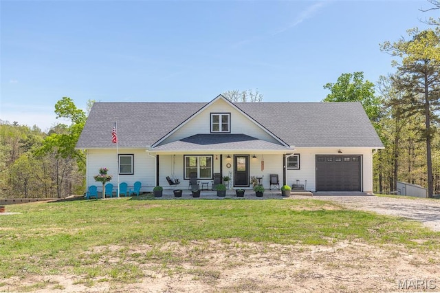 176 Carter 205, Van Buren, MO 63965 - modern farmhouse with a garage, covered porch, driveway, a front yard, and a shingled roof