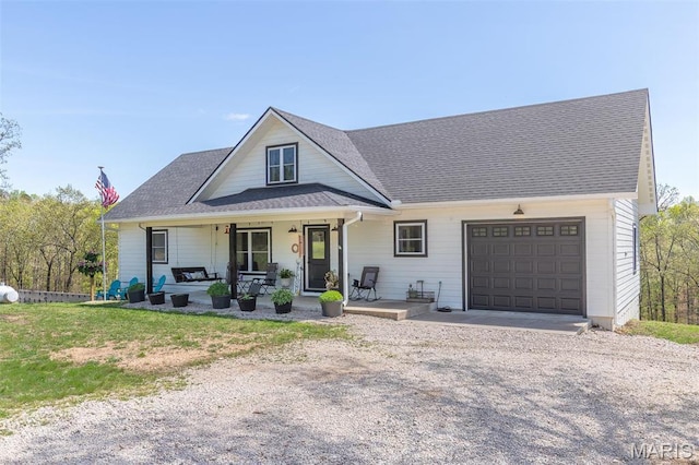 176 Carter 205, Van Buren, MO 63965 - view of front of home featuring a garage, a porch, and driveway