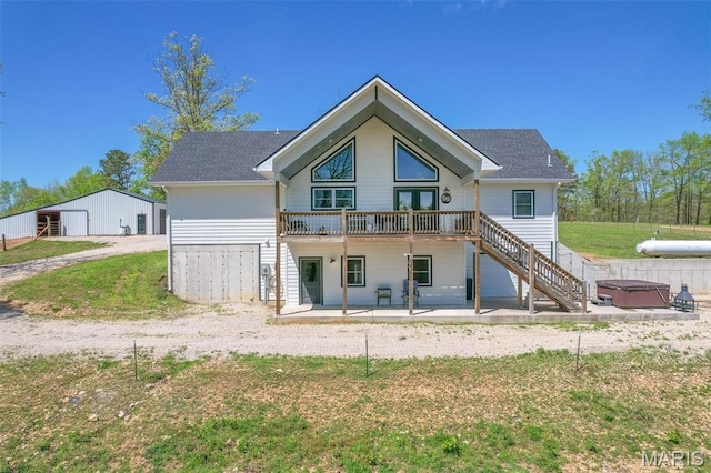 176 Carter 205, Van Buren, MO 63965 - back of house with a hot tub, a patio, a deck, and stairs