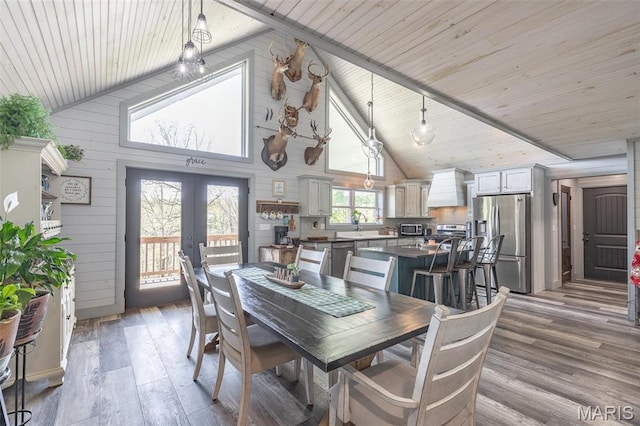 176 Carter 205, Van Buren, MO 63965 - dining space featuring light wood-style flooring, wooden ceiling, french doors, high vaulted ceiling, and wooden walls